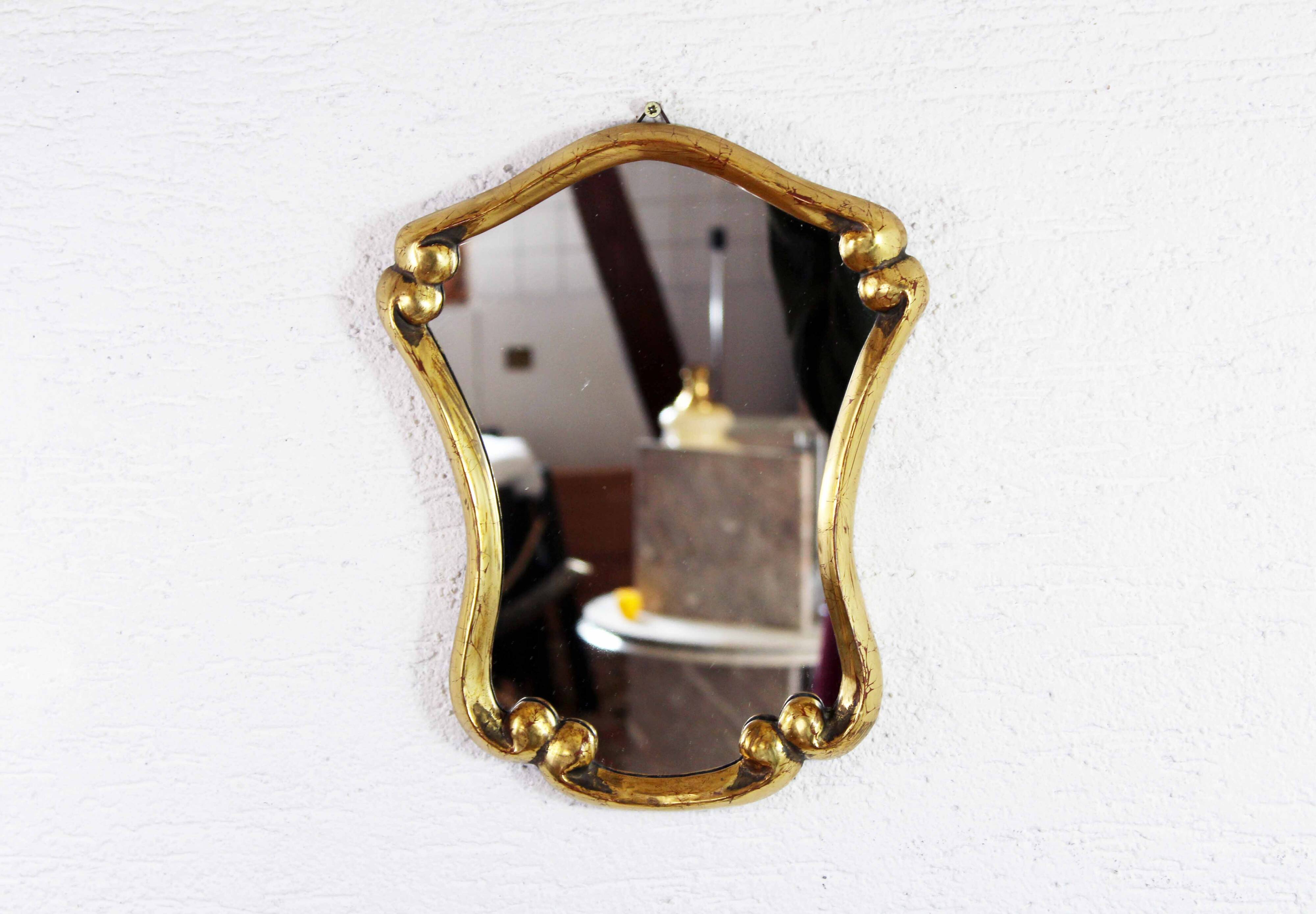 Mirror in gilded wood with leaf