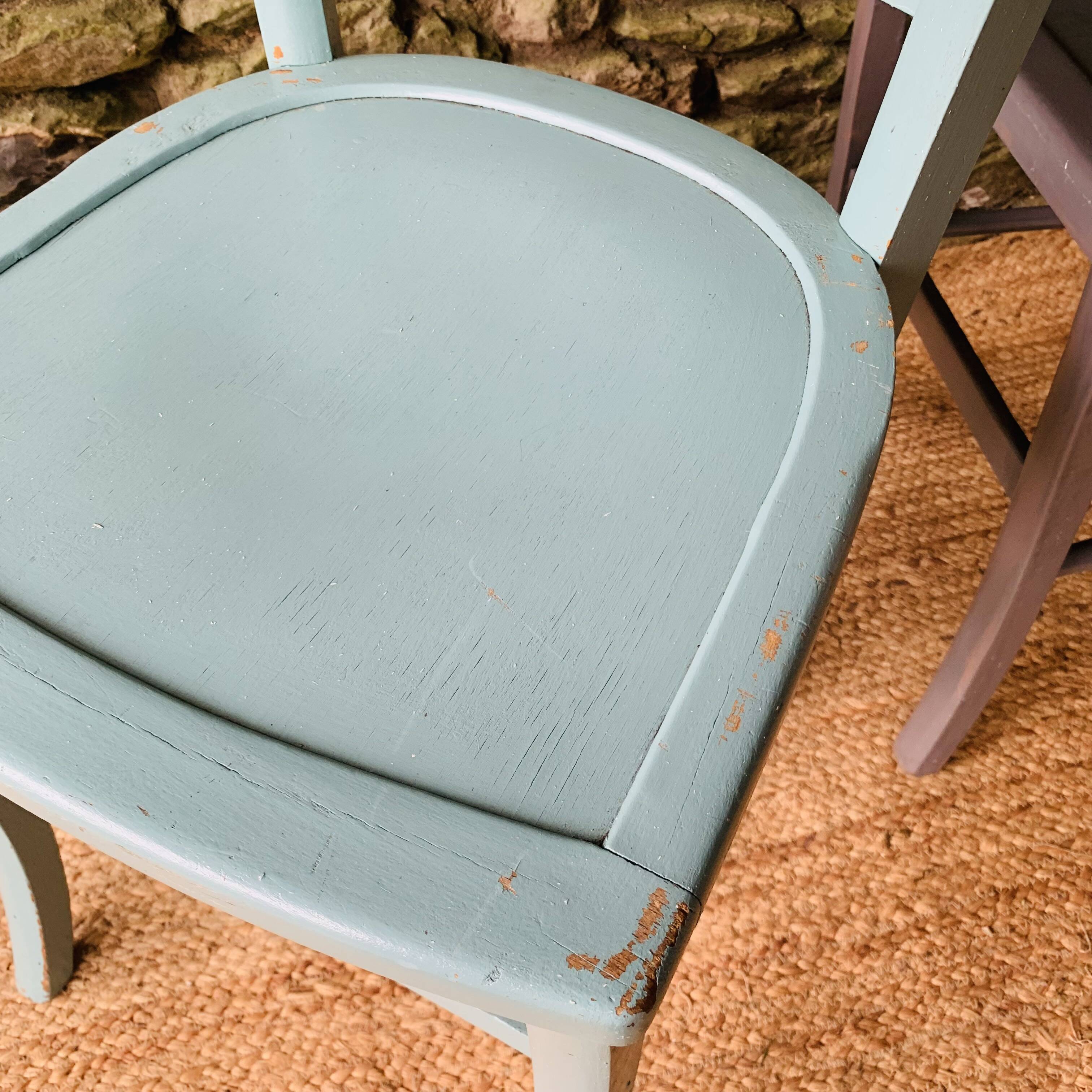 Set of four mismatched bistro chairs