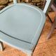Set of four mismatched bistro chairs