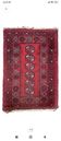 Bukhara Oriental carpet in wool with geometric patterns on a red background,