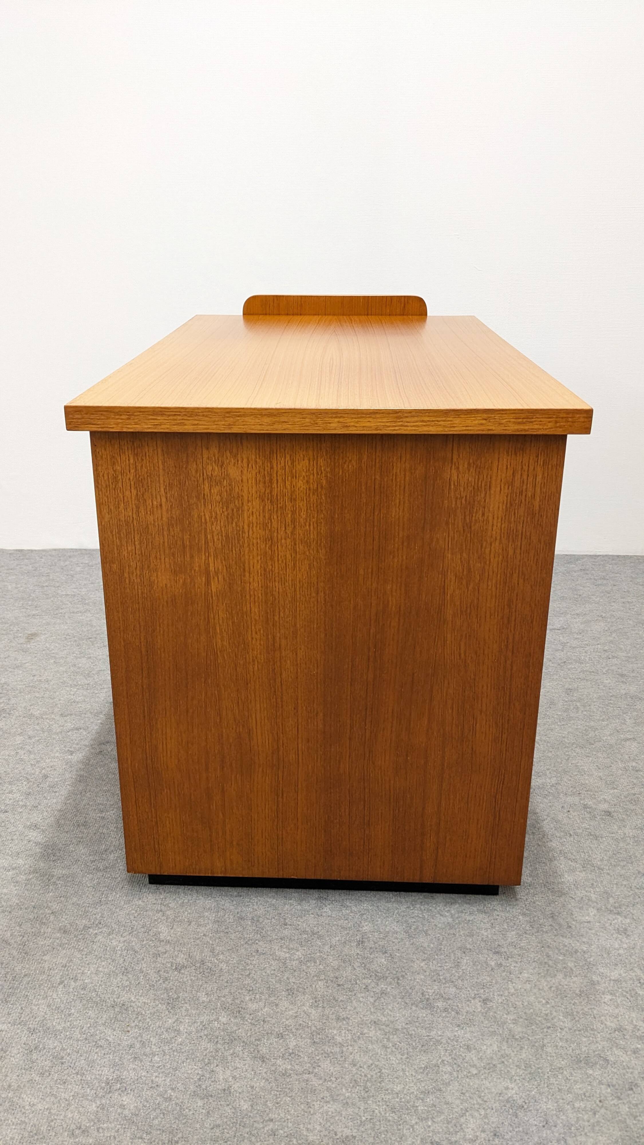 Modernist desk in blonde rosewood, France circa 1960.