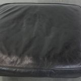 Large and timeless black ottoman made of cowhide leather in English style