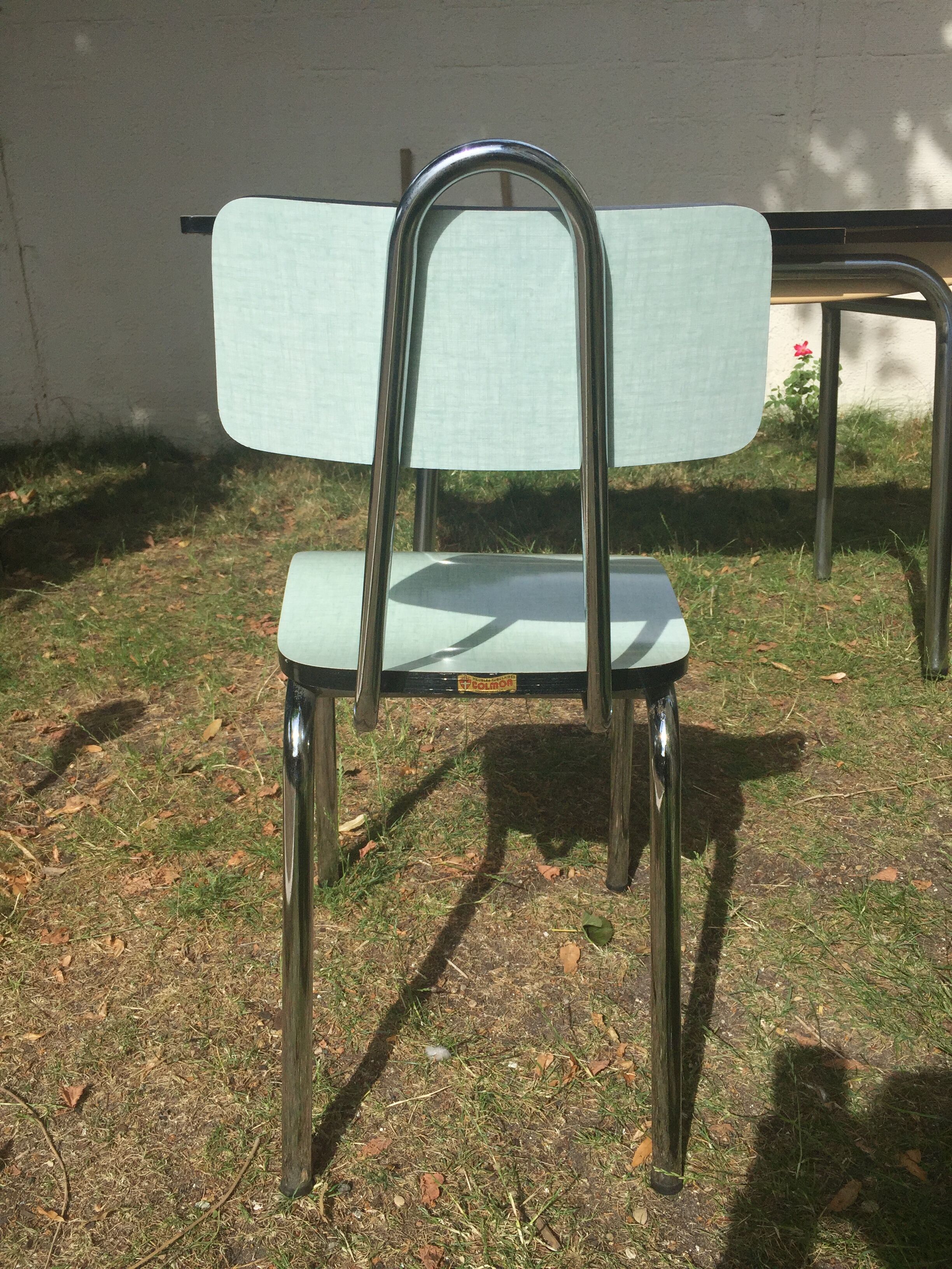 Table and 4 green water formica chairs 60's