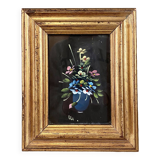 Golden frame with painting bouquet of flowers