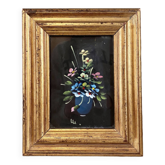 Golden frame with painting bouquet of flowers