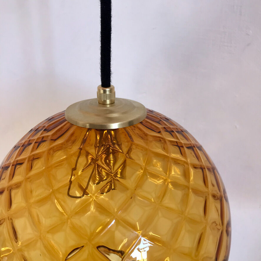 Amber glass globe suspension