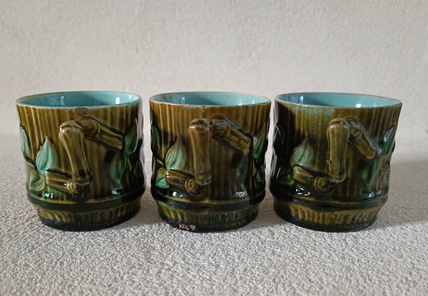 3 cups and saucers in bamboo-decorated earthenware