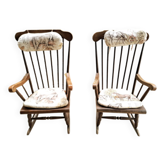 2 rocking chairs with horse motif cushions