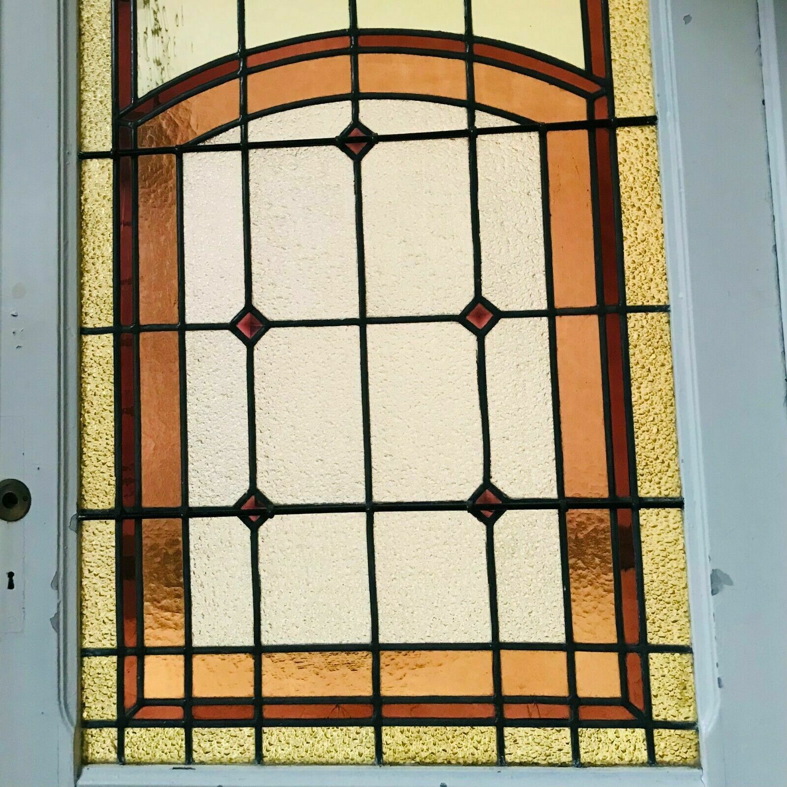 Separation of three doors in 20th century Art Deco stained glass