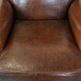 Sheep leather armchair on wheels