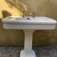 Antique washbasin on ceramic column