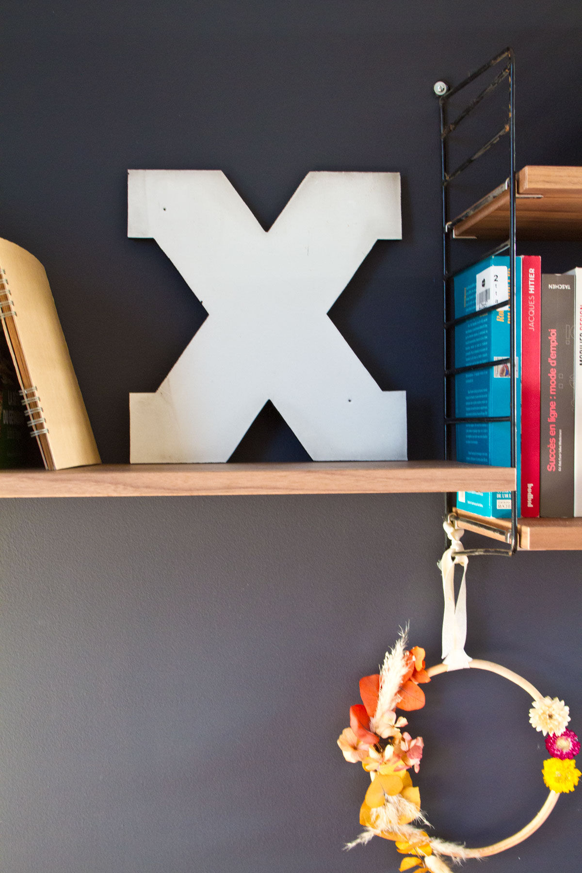 Enamelled letter X