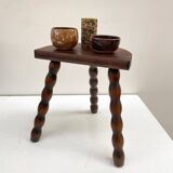 Series of 4 small tripod stools with half-moon seat and beaded turned wood legs