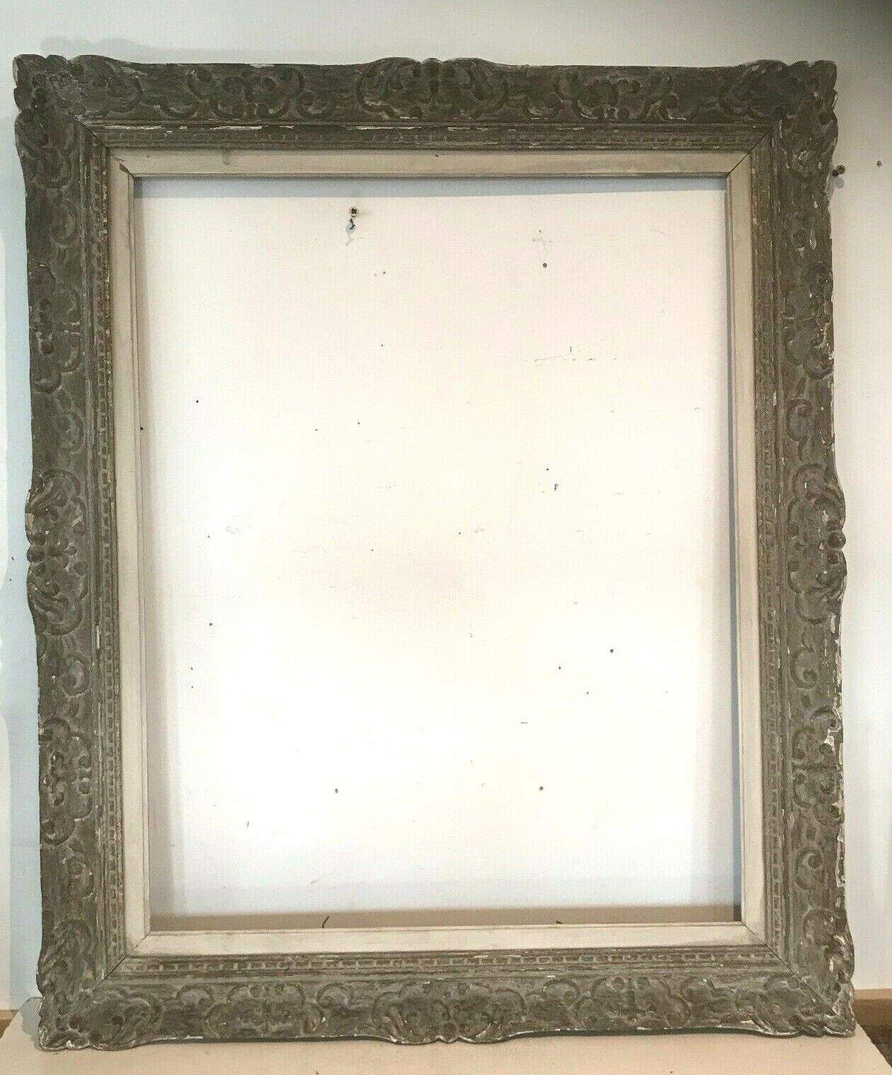 Wooden frame and patinated stucco XX century