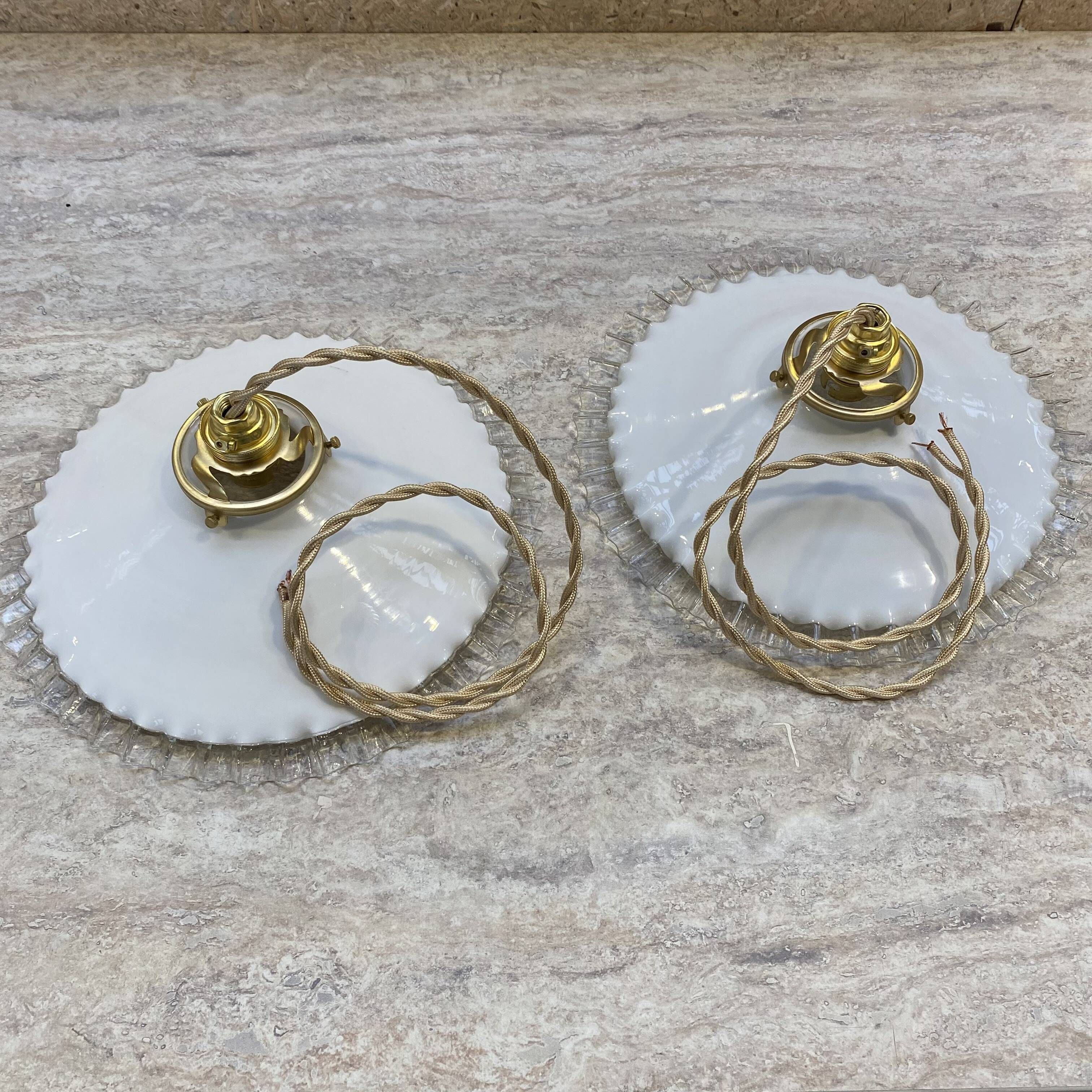 Pair of vintage pendant lights in opaline and transparent serrated edges