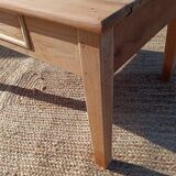 Low farmhouse table in raw wood