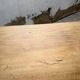 Oak farmhouse table with turned black legs.