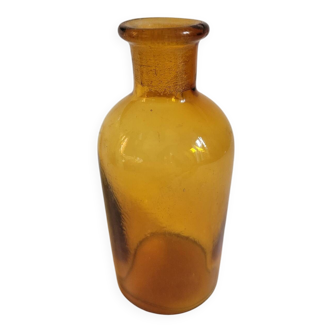 Small orange-yellow apothecary bottle