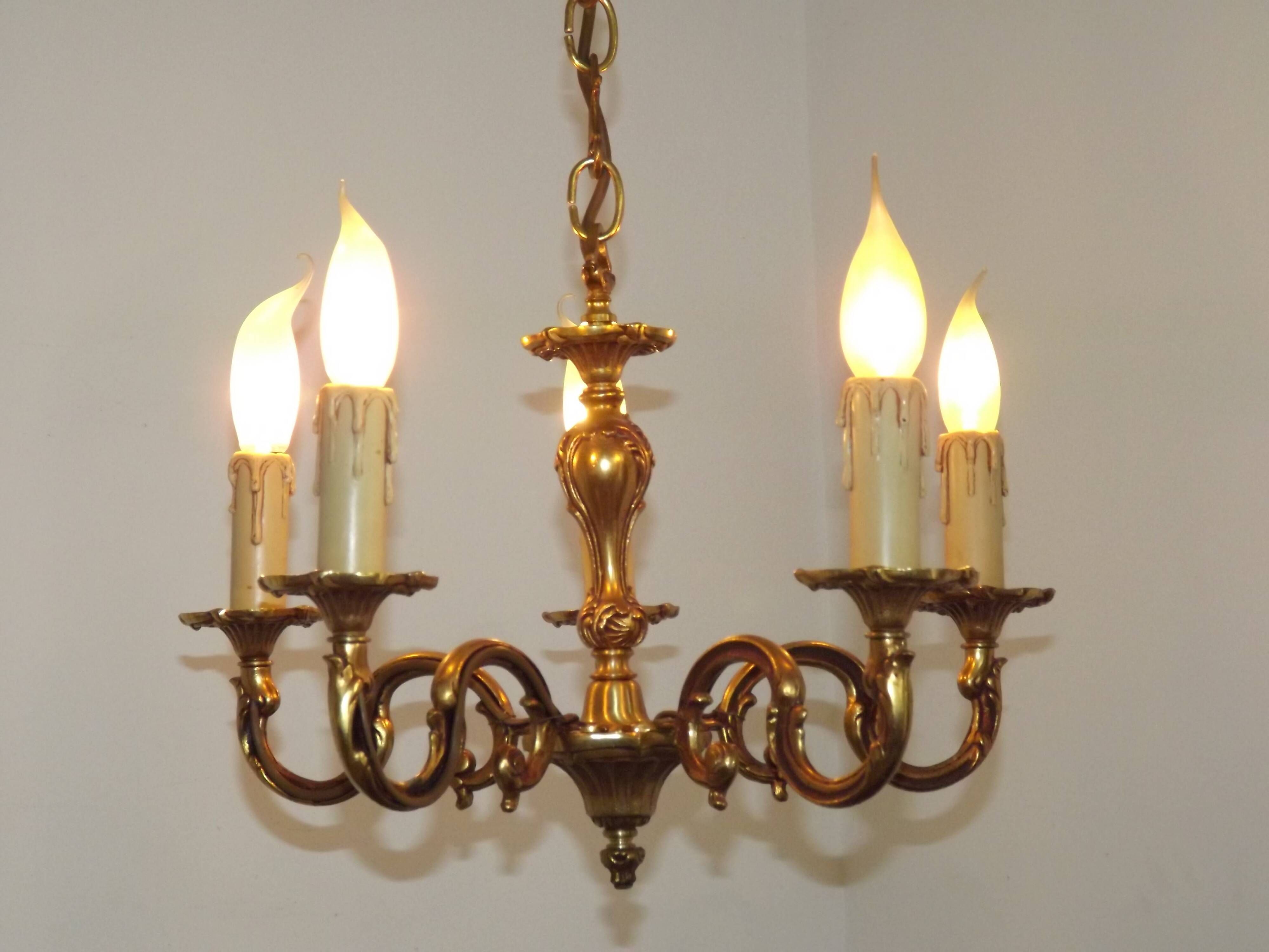Vintage French traditional style bronze chandelier with 5 lights featuring acanthus leaf details.