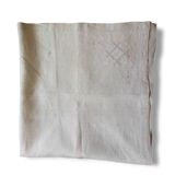 Embroidered string of white linen tablecloth