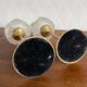Pair of tulip-shaped candle holders in frosted glass and brass.