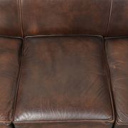 Set of a smooth chesterfield sofa and armchair with a timeless English look