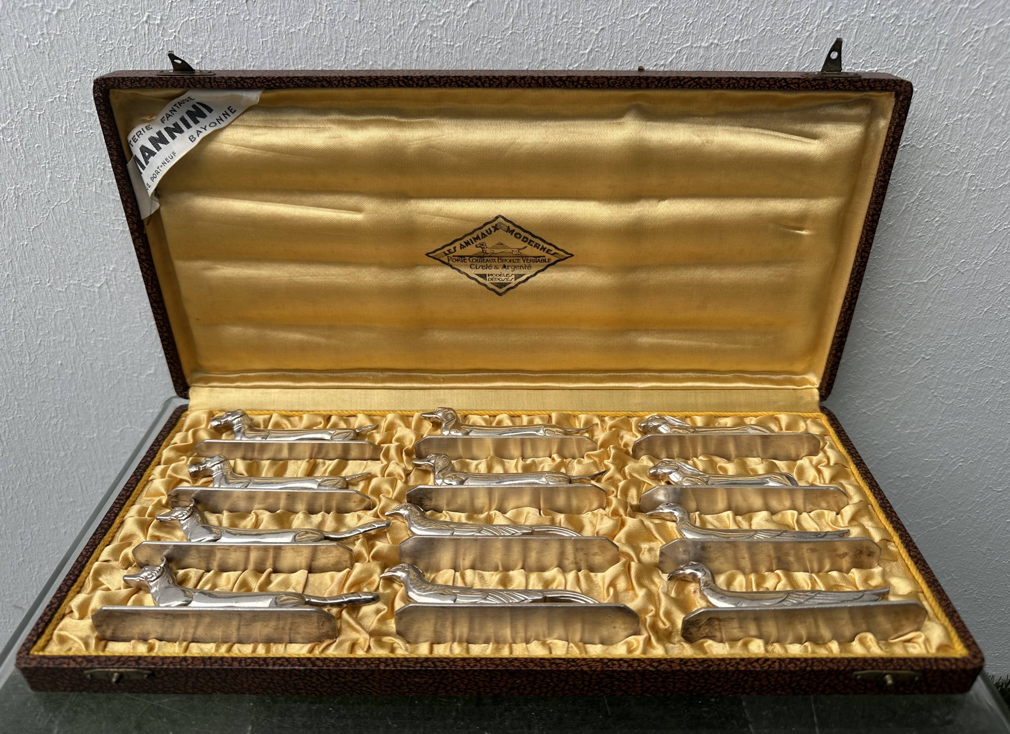12 antique silver-plated bronze knife rests in modern art deco animal designs.