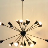 Sputnik 24 arms in black lacquered metal and brass chandelier