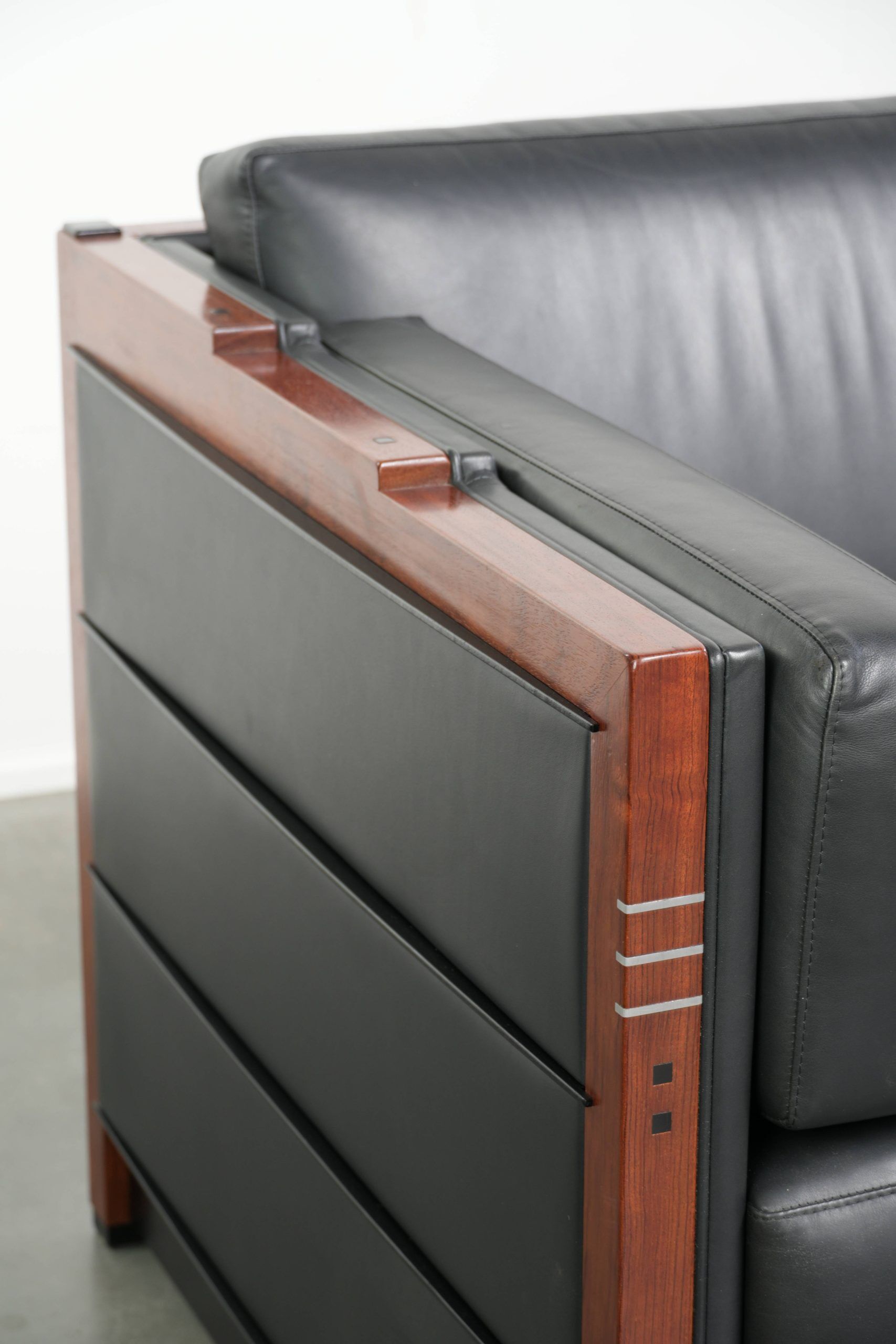 3-seater black cow leather sofa in timeless Art Deco design
