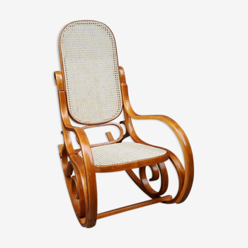 Rocking-chair in bent wood and caning