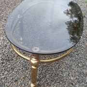 Oval coffee table in gilded brass and smoked glass 1970