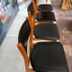4 Scandinavian chairs in teak and black faux leather.