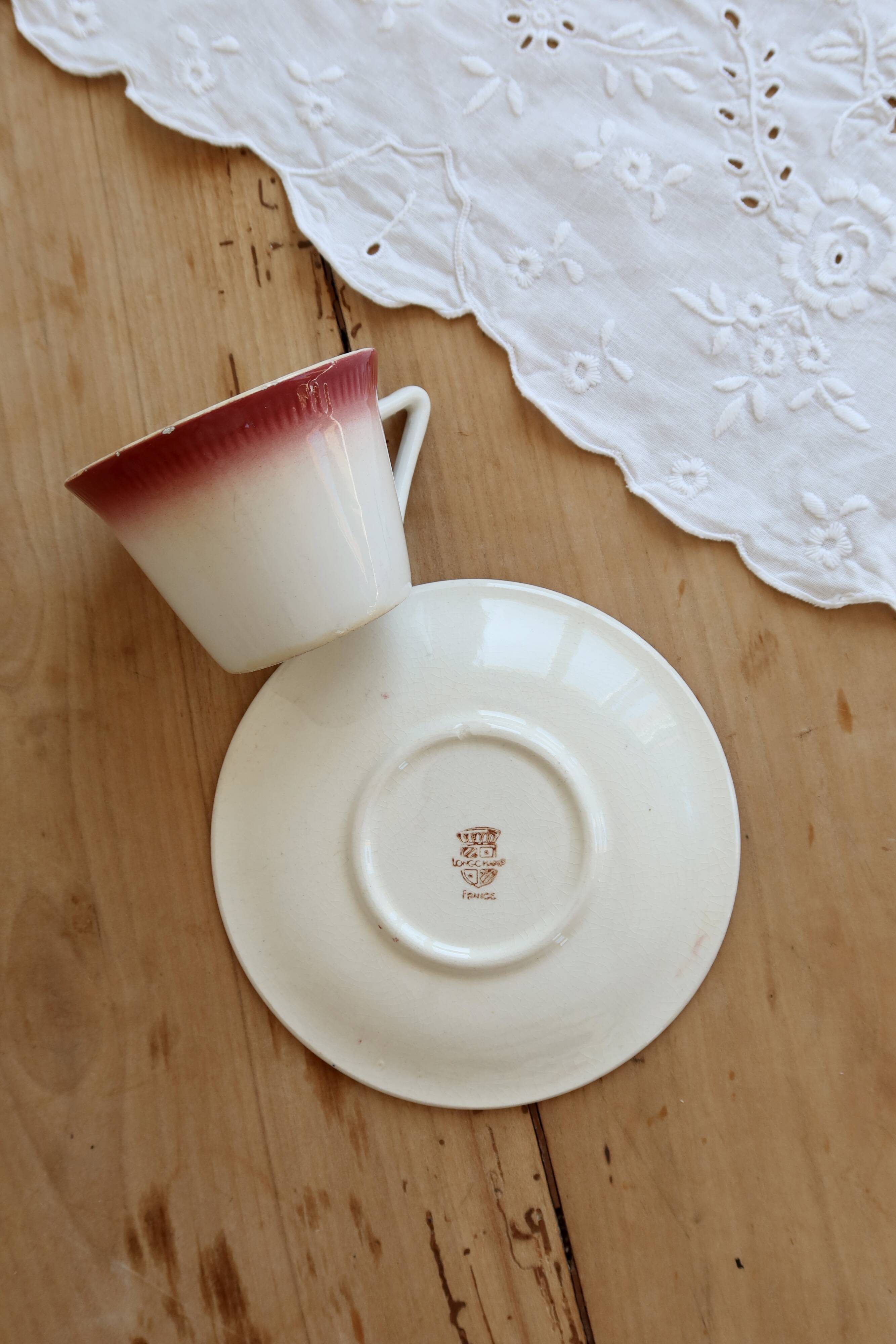 Antique Longchamp ironstone coffee cup with saucer.