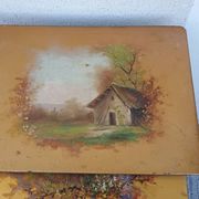 Sets of three nesting tables with painted landscape decorations in poplar.