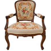 Louis XV style carved wooden armchair with floral needlepoint upholste