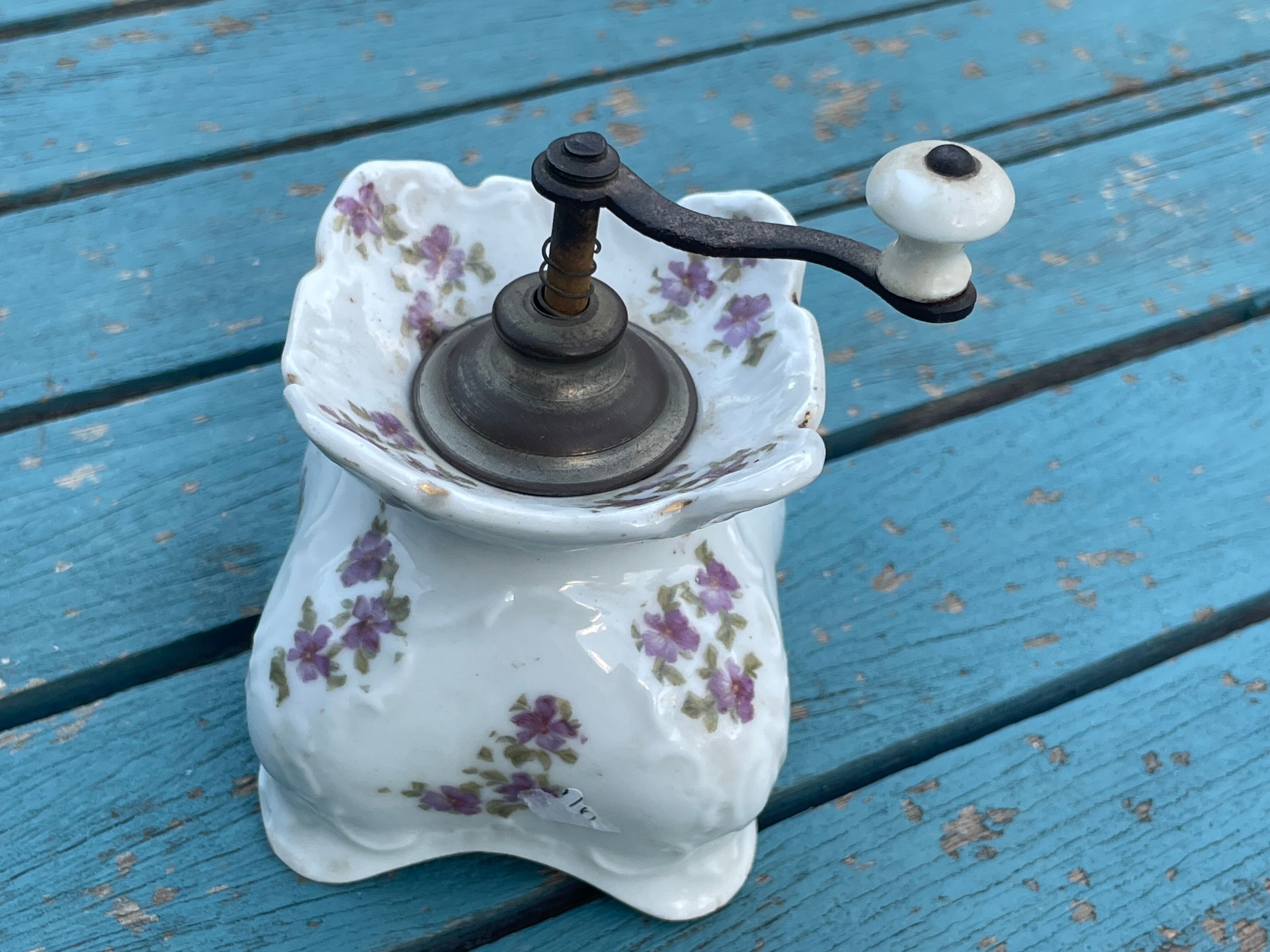 Old porcelain pepper mill