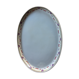 Plat oval en porcelaine à décor de fleurs