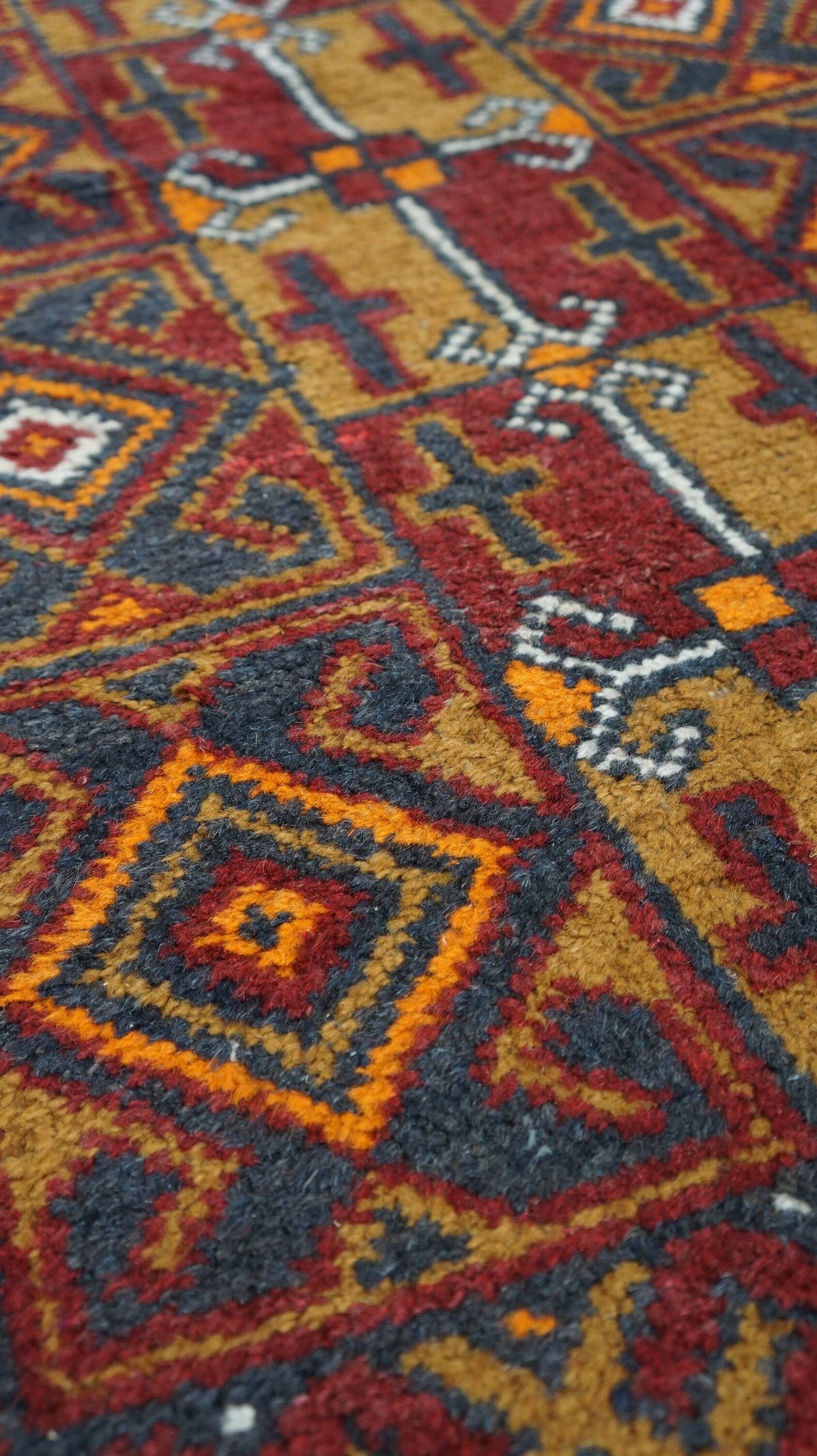 Antique oriental rug featuring orange details 135x81cm