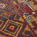 Antique oriental rug featuring orange details 135x81cm