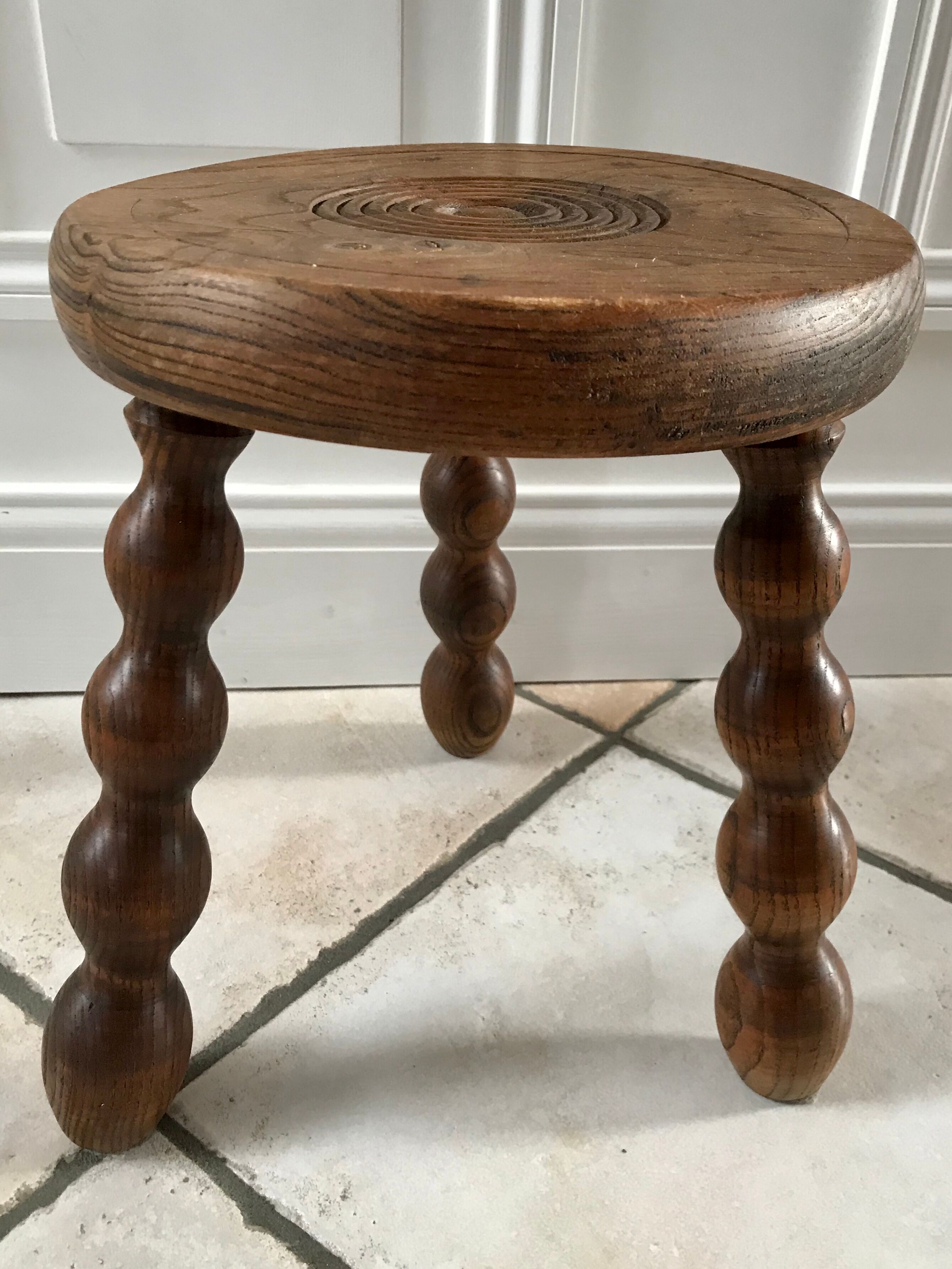 Low wooden stool turned solid 70s