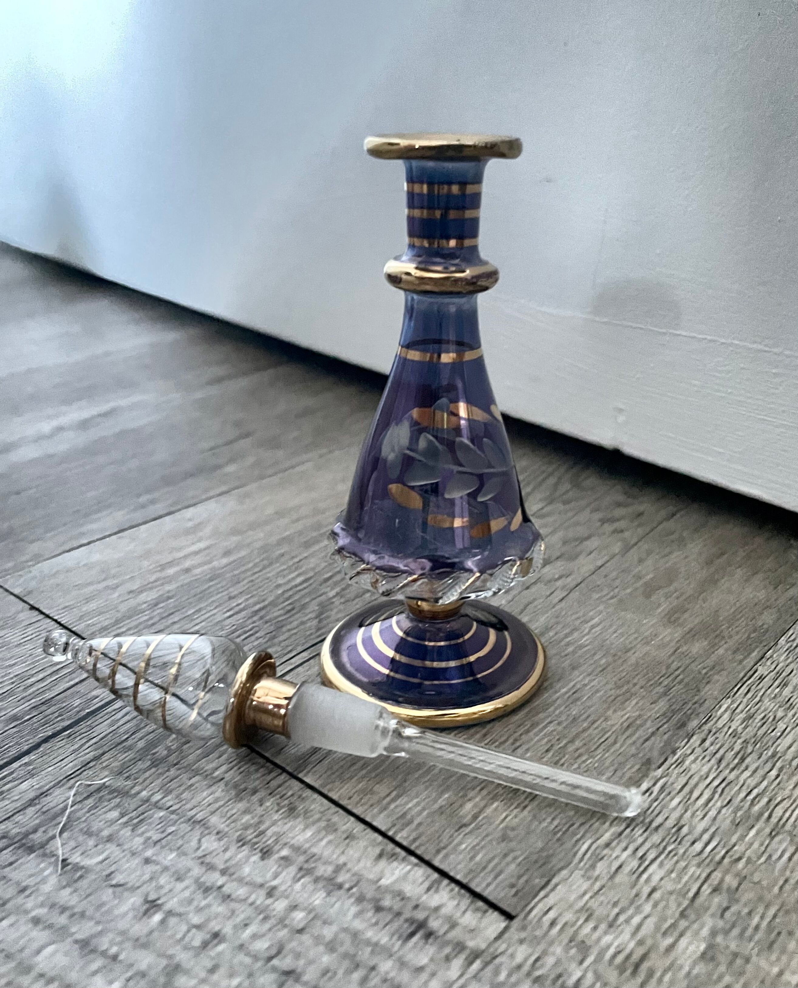 Purple glass perfume bottle