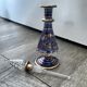 Purple glass perfume bottle