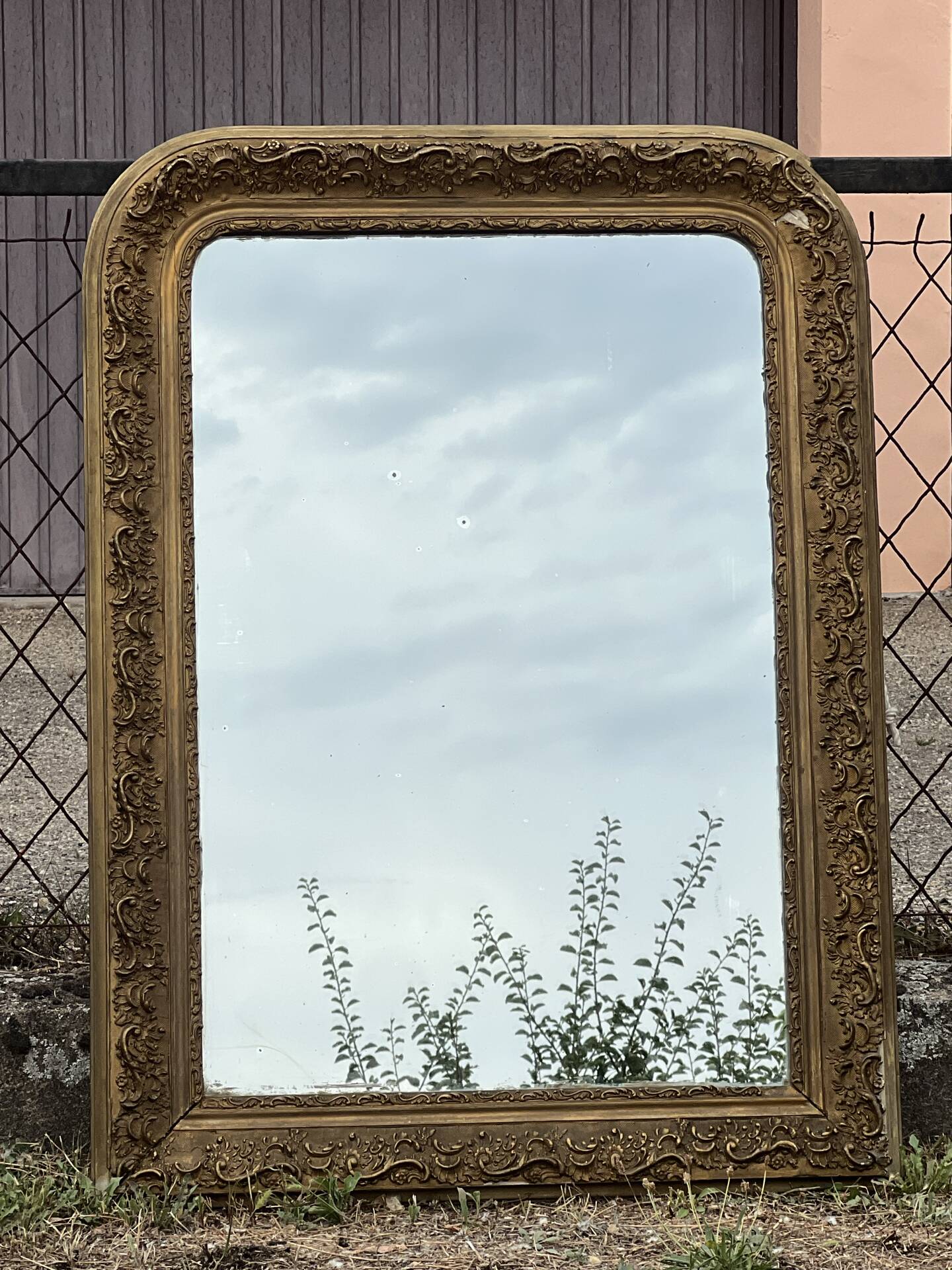 Large gilded sculpted Louis-Philippe mirror, mercury 104x77cm