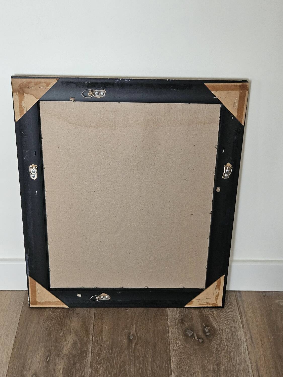 Beveled mirror under gold frame