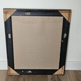 Beveled mirror under gold frame