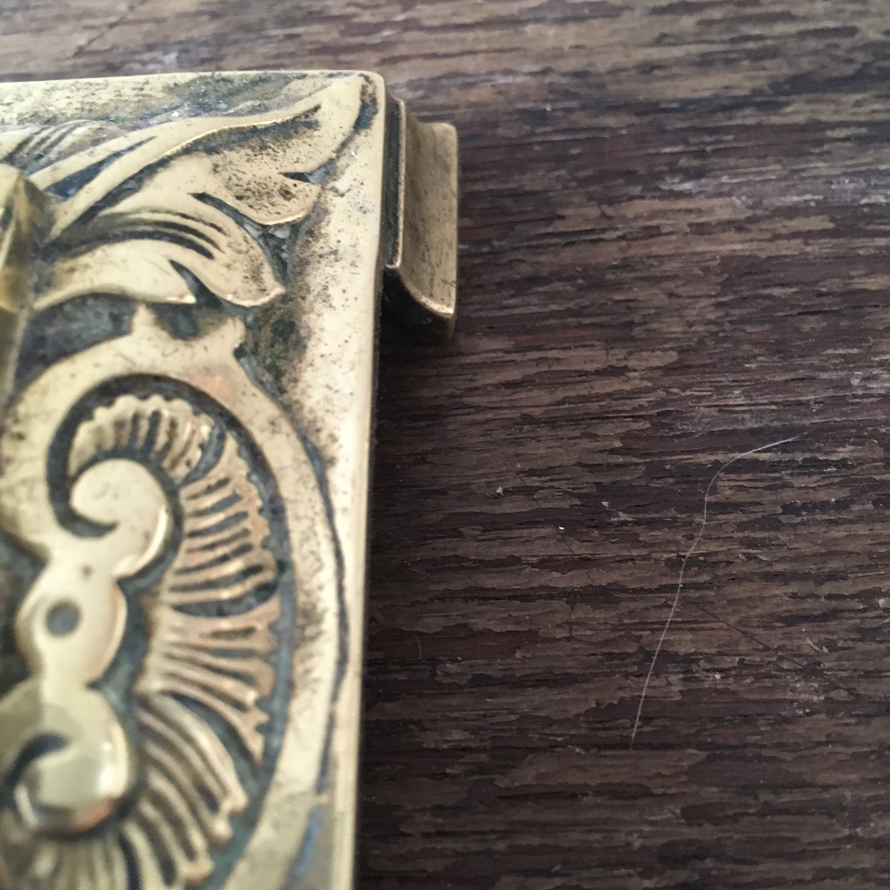 Old brass candle holder with square base