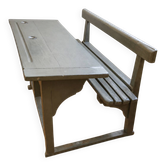 Old school desk for two with ink wells.