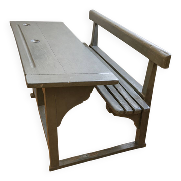 Old school desk for two with ink wells.