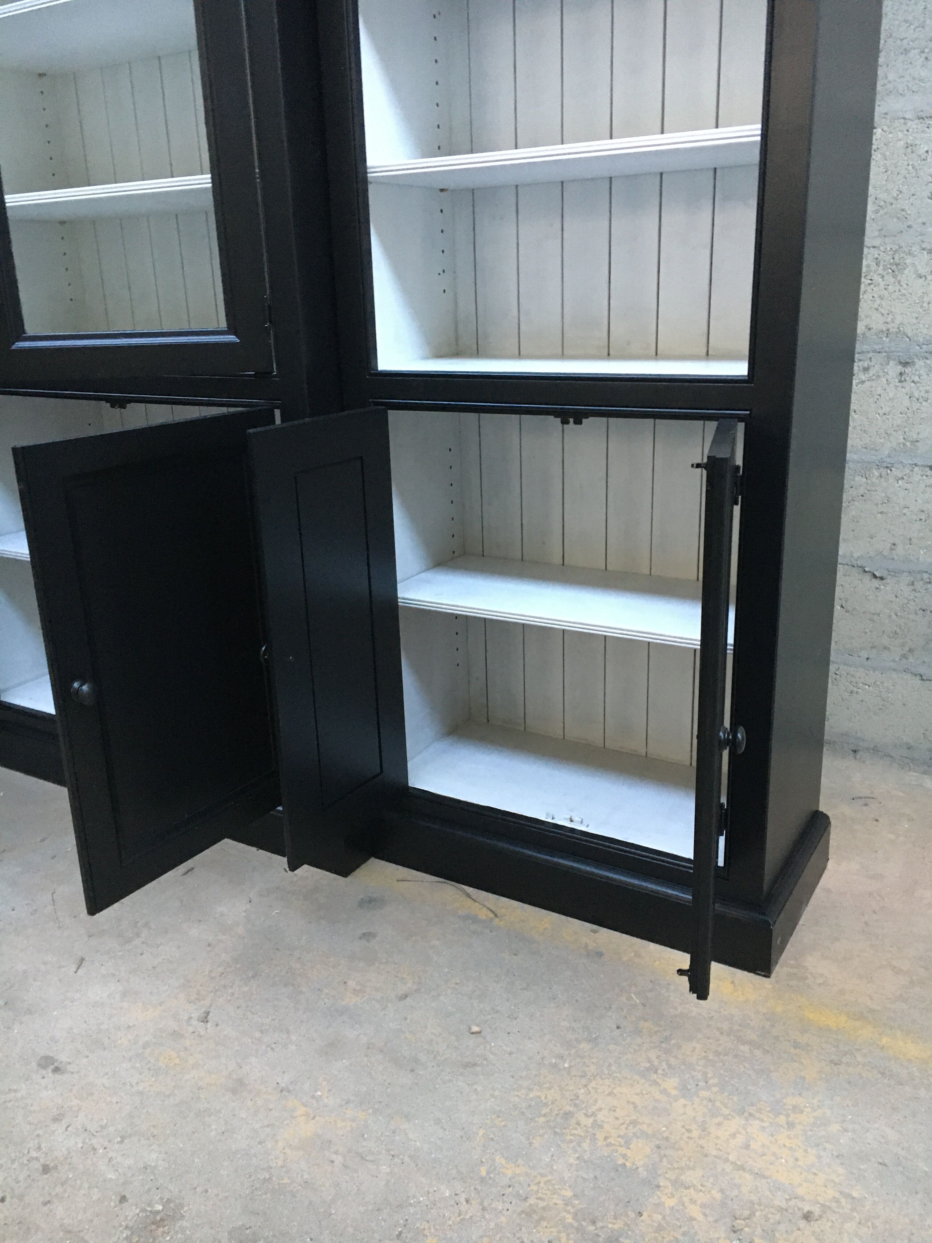 Black patinated wooden bookcase