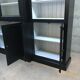 Black patinated wooden bookcase